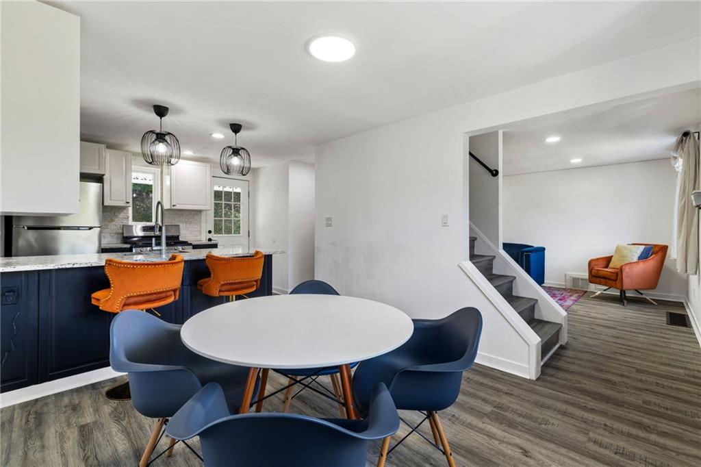 8144 Lincoln Road Verona, PA 15147 - Photo 12 of 33 a view of a dining room with furniture and wooden floor