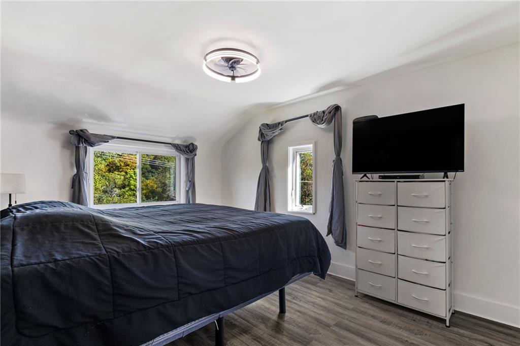 8144 Lincoln Road Verona, PA 15147 - Photo 16 of 33 a bedroom with a bed and a flat screen tv