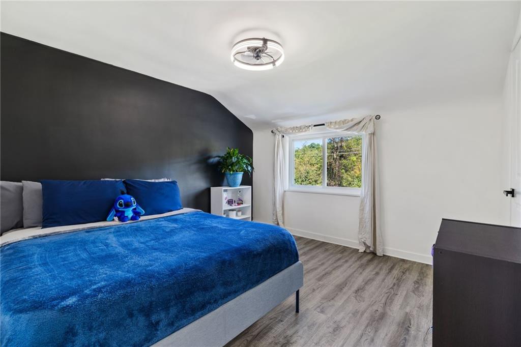 8144 Lincoln Road Verona, PA 15147 - Photo 18 of 33 a bedroom with a large bed and a window