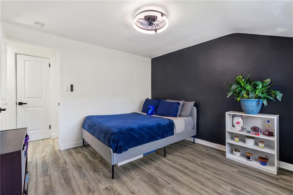 8144 Lincoln Road Verona, PA 15147 - Photo 19 of 33 a bedroom with a bed and a book shelf