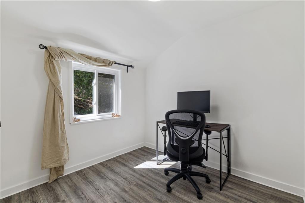 8144 Lincoln Road Verona, PA 15147 - Photo 21 of 33 a view of a workspace with furniture and wooden floor