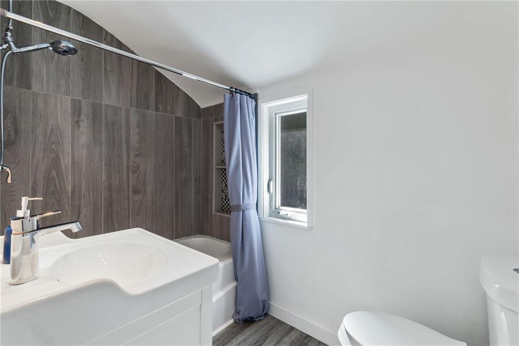 8144 Lincoln Road Verona, PA 15147 - Photo 23 of 33 a bathroom with a sink a toilet and shower