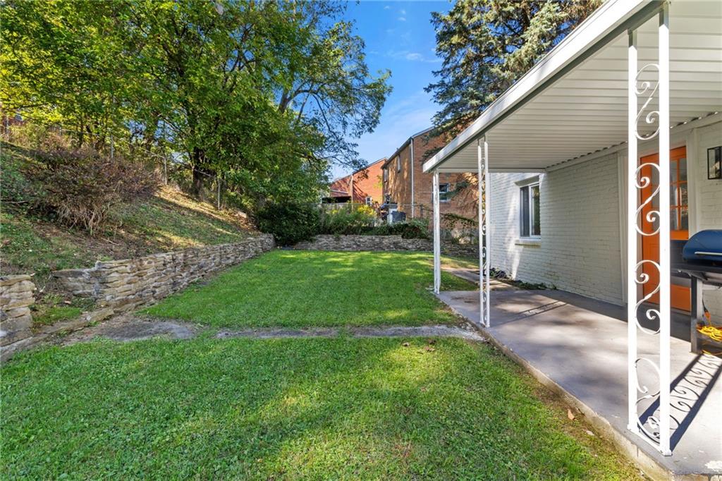 8144 Lincoln Road Verona, PA 15147 - Photo 28 of 33 a view of a house with a yard