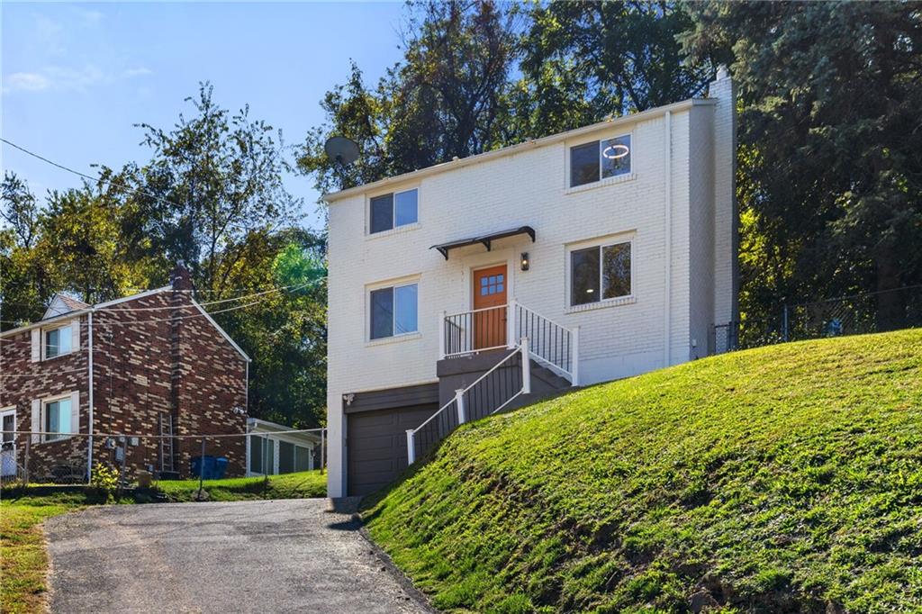 8144 Lincoln Road Verona, PA 15147 - Photo 3 of 33 a view of a house with a yard and potted plants
