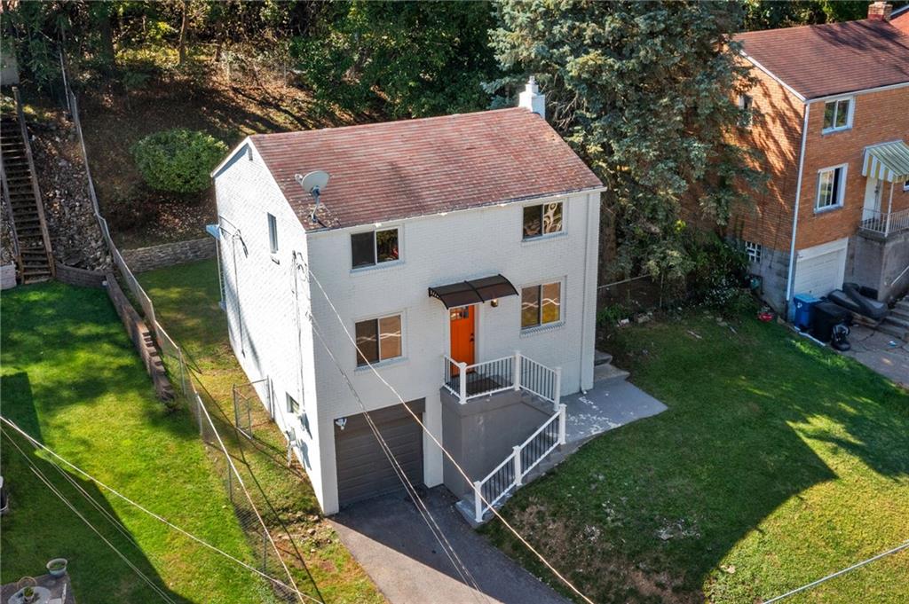 8144 Lincoln Road Verona, PA 15147 - Photo 32 of 33 a aerial view of a house with swimming pool garden view and trees