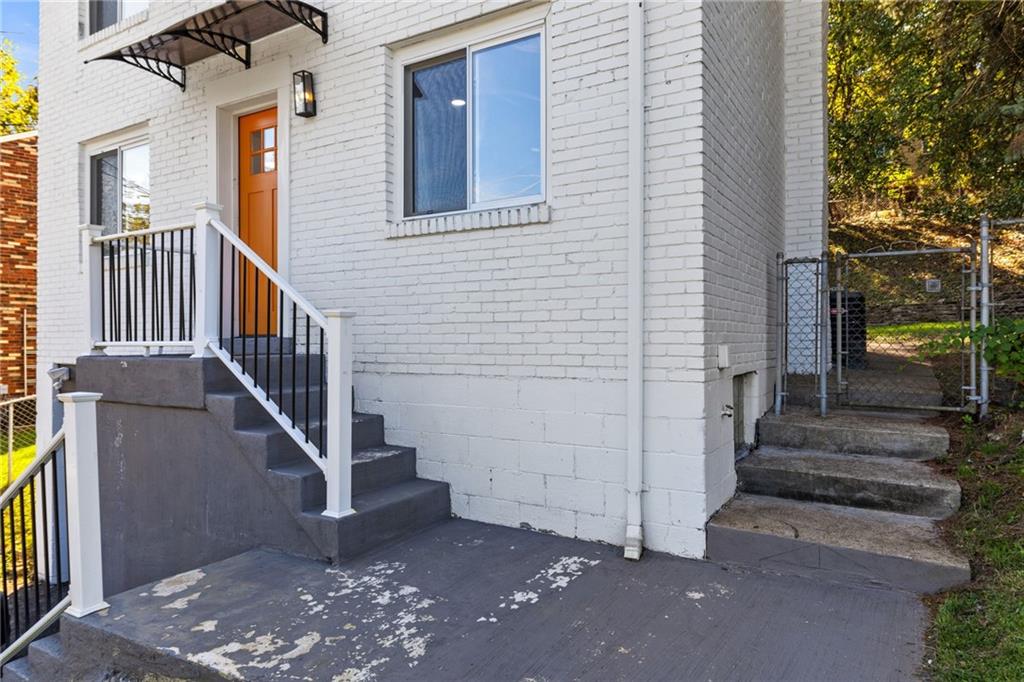 8144 Lincoln Road Verona, PA 15147 - Photo 4 of 33 a view of a house with stairs and wooden fence