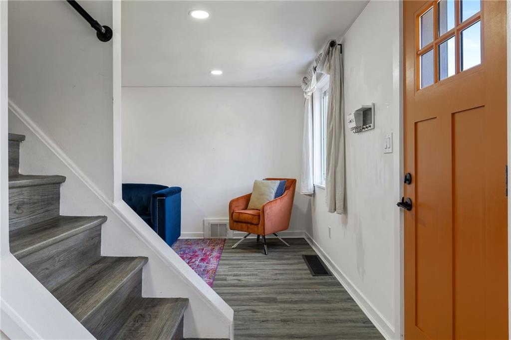 8144 Lincoln Road Verona, PA 15147 - Photo 5 of 33 a balcony with chairs and wooden floor