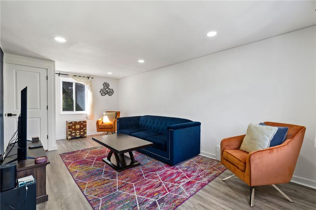 8144 Lincoln Road Verona, PA 15147 - Photo 6 of 33 a living room with furniture and a rug