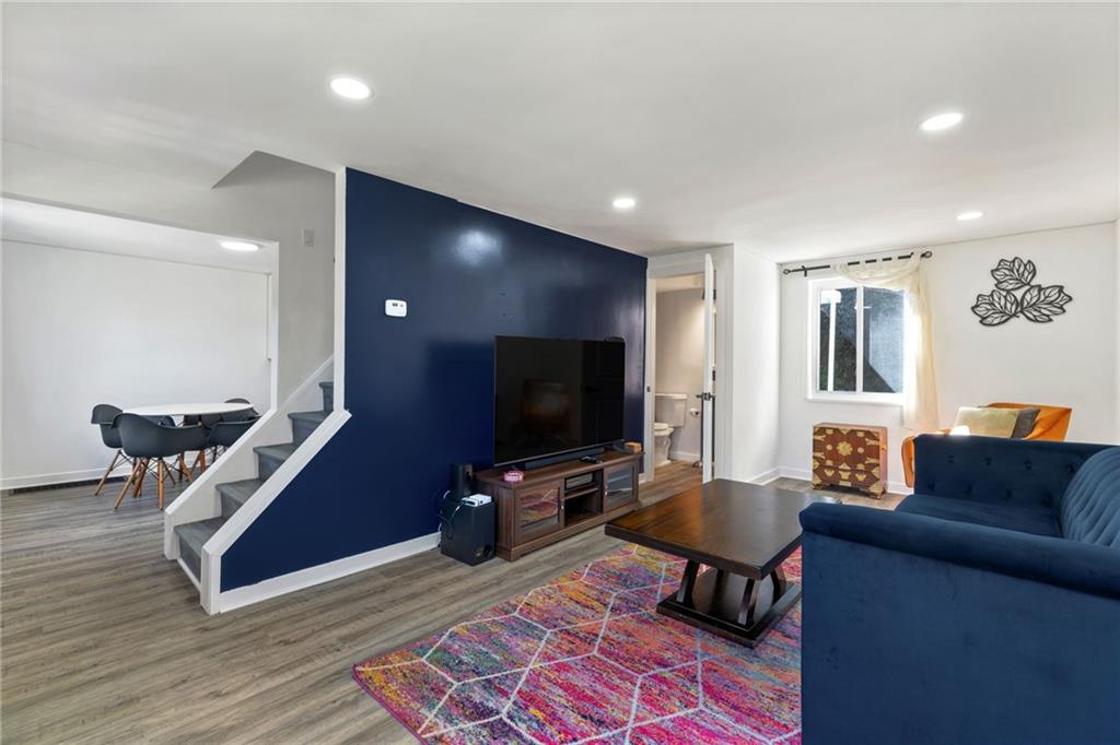 8144 Lincoln Road Verona, PA 15147 - Photo 7 of 33 a living room with furniture and a flat screen tv