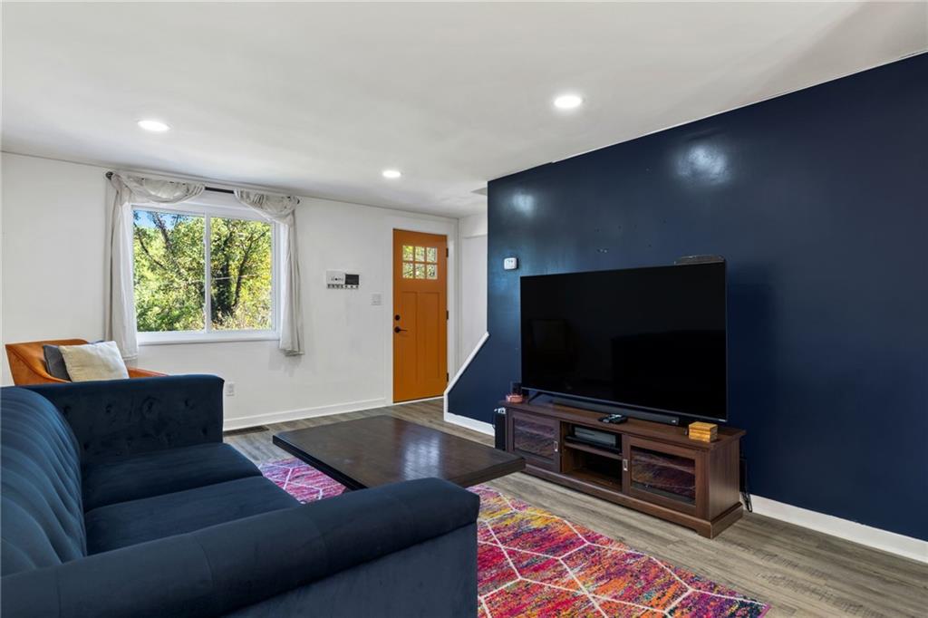 8144 Lincoln Road Verona, PA 15147 - Photo 8 of 33 a living room with furniture and a flat screen tv