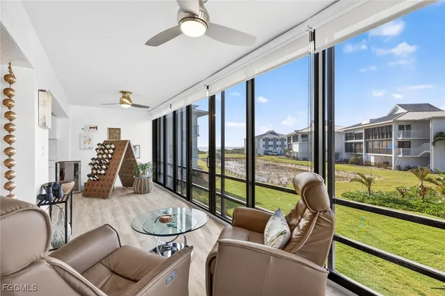 a room with furniture and a large window