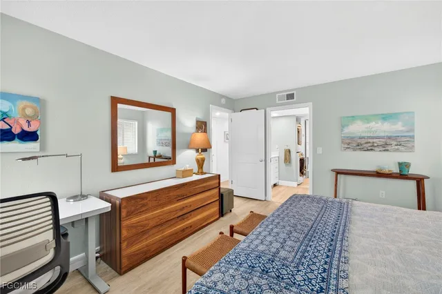 a bedroom with furniture and a bathtub