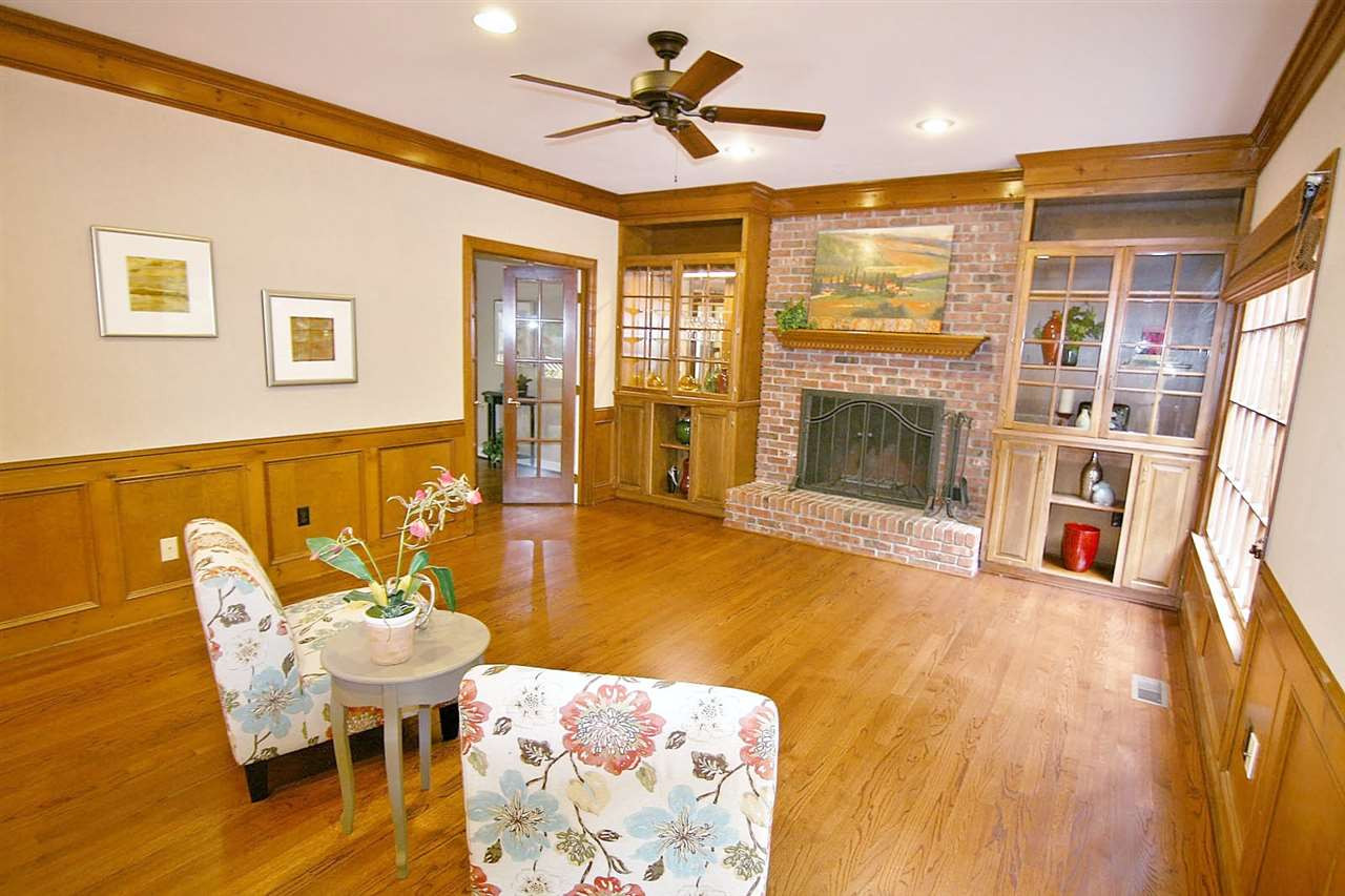2001 Countrywood Road North Raleigh, NC 27615 - Photo 10 of 25 Gorgeous wood-burning fireplace, with built in bookcases on each side Family Room