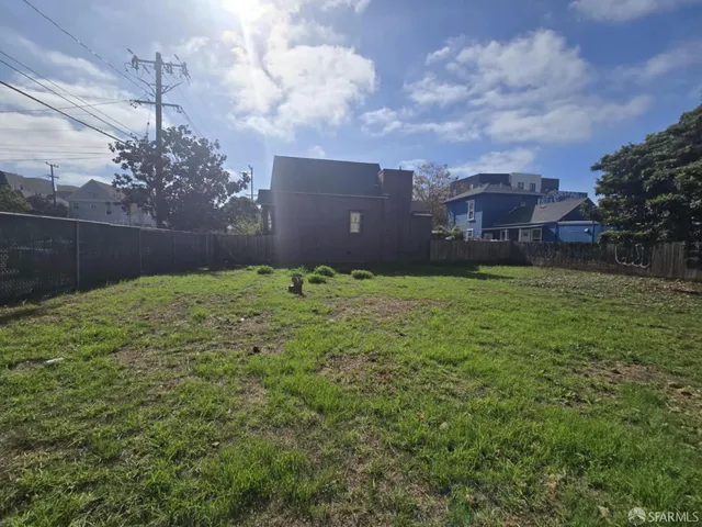 a backyard of a house with lots of green space