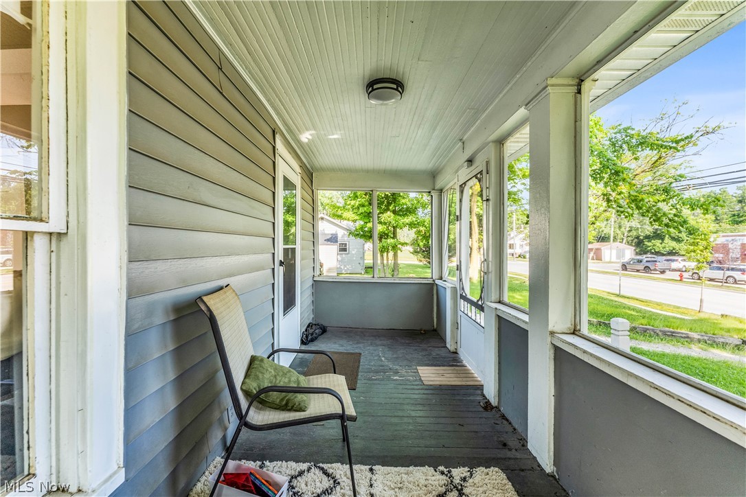 422 West Smith Road Medina, OH 44256 - Photo 3 of 29 Enclosed front porch with horizontal siding and a beadboard ceiling