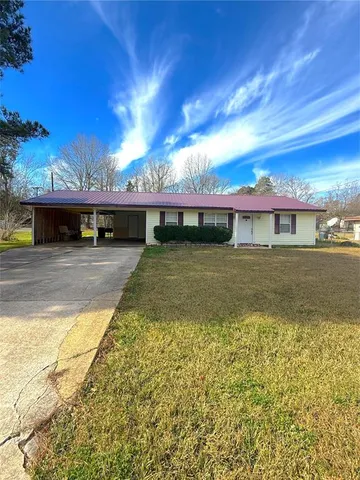 a view of a swimming pool with outdoor seating