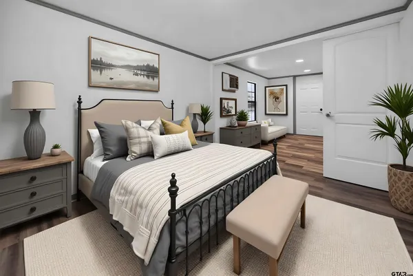 a bedroom with double bed and a potted plant