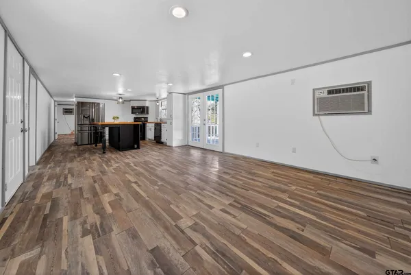 a view of a livingroom with wooden floor