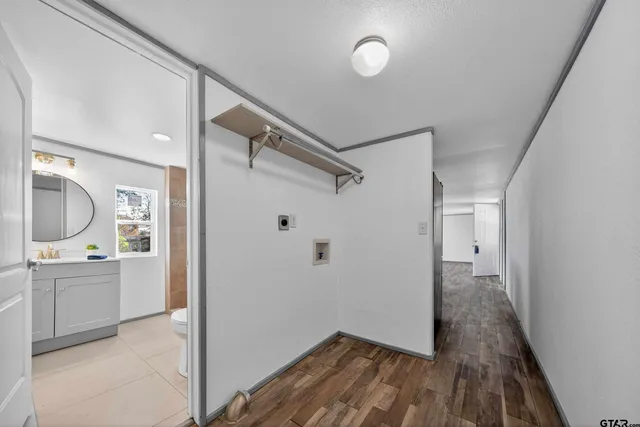 a bathroom with a sink and mirror