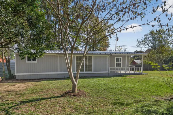 a backyard of a house with lots of green space