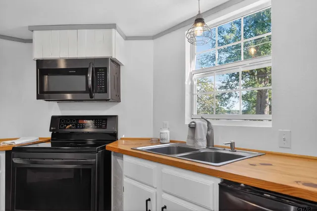 a kitchen with a sink and cabinets