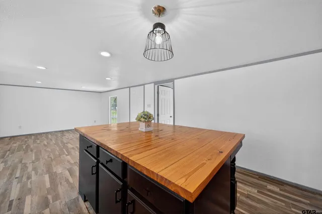 a view of a dining table chairs and wooden floor