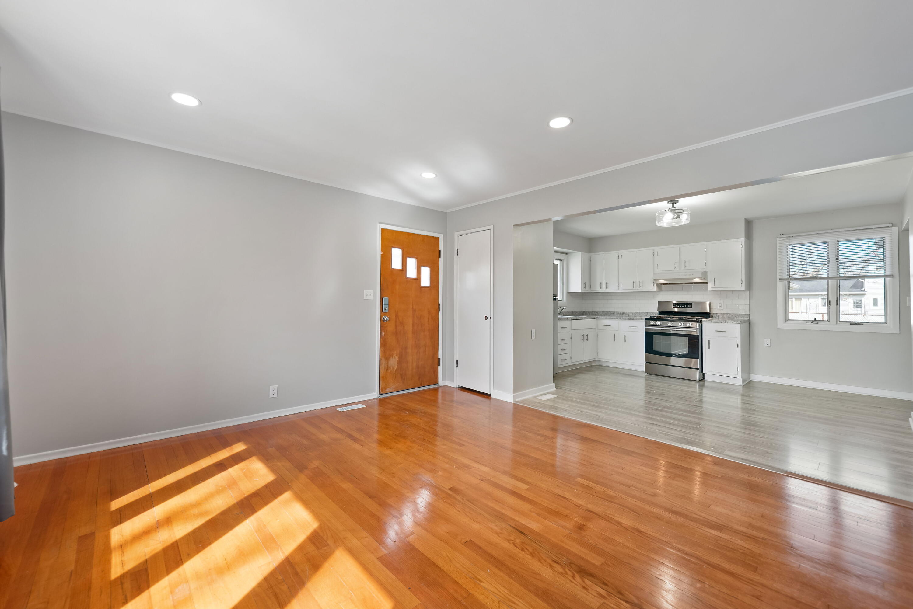 8143 Grace Street Highland, IN 46322 - Photo 7 of 18 a view of kitchen and hall with wooden floor