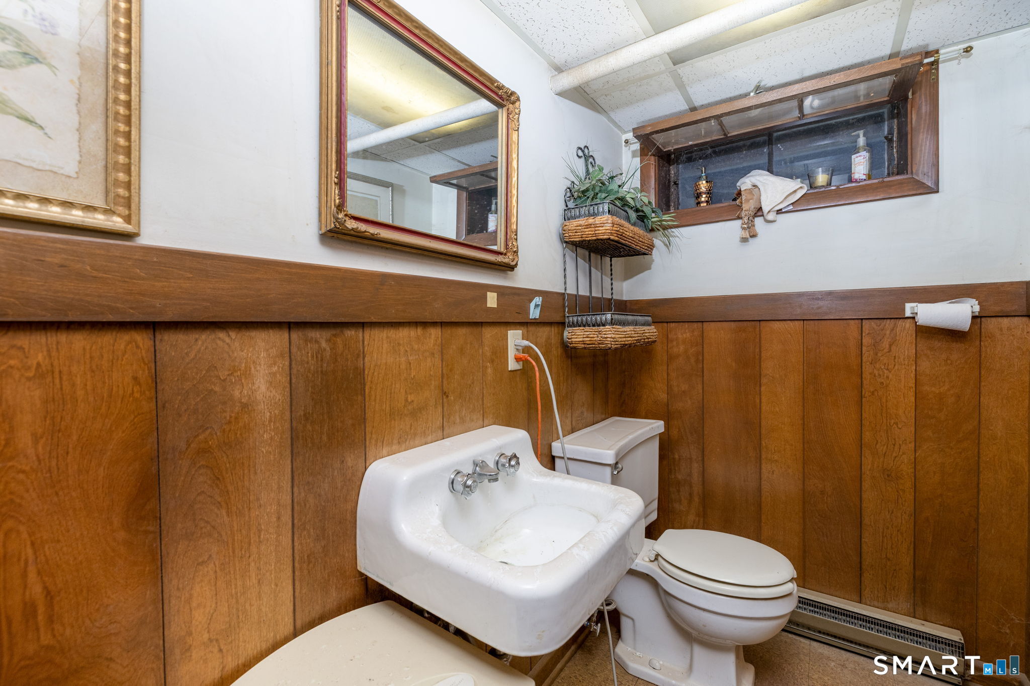 325 Barbara Road Middletown, CT 06457 - Photo 39 of 40 a bathroom with a sink toilet and mirror