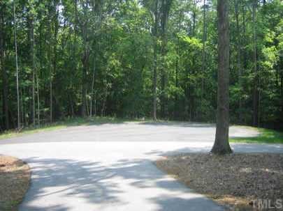 15509 Possum Track Road, Unit LOT 3 Raleigh, NC 27614 - Photo 1 of 1 a view of a yard with a tree