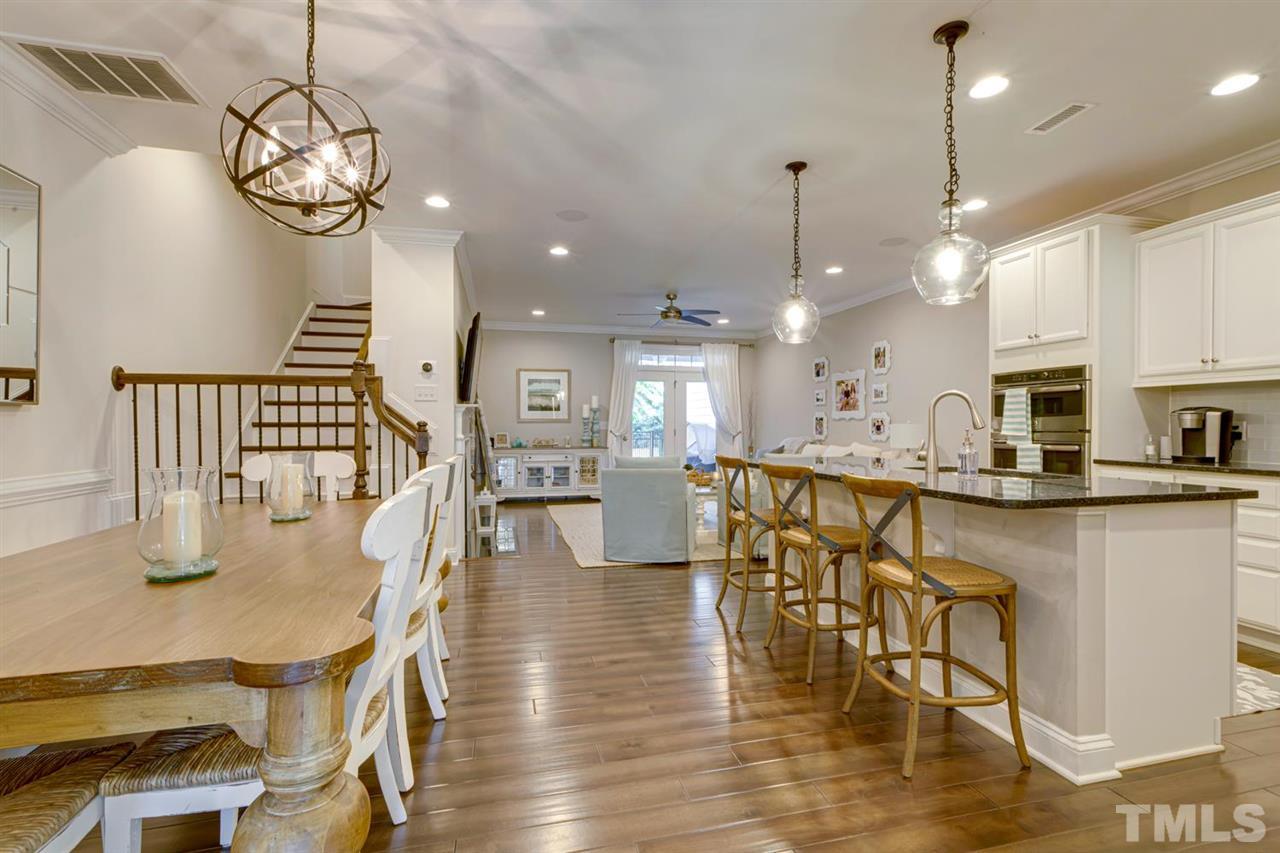 708 Fallon Grove Way Raleigh, NC 27608 - Photo 11 of 30 a dining room filled chandelier and wooden floor