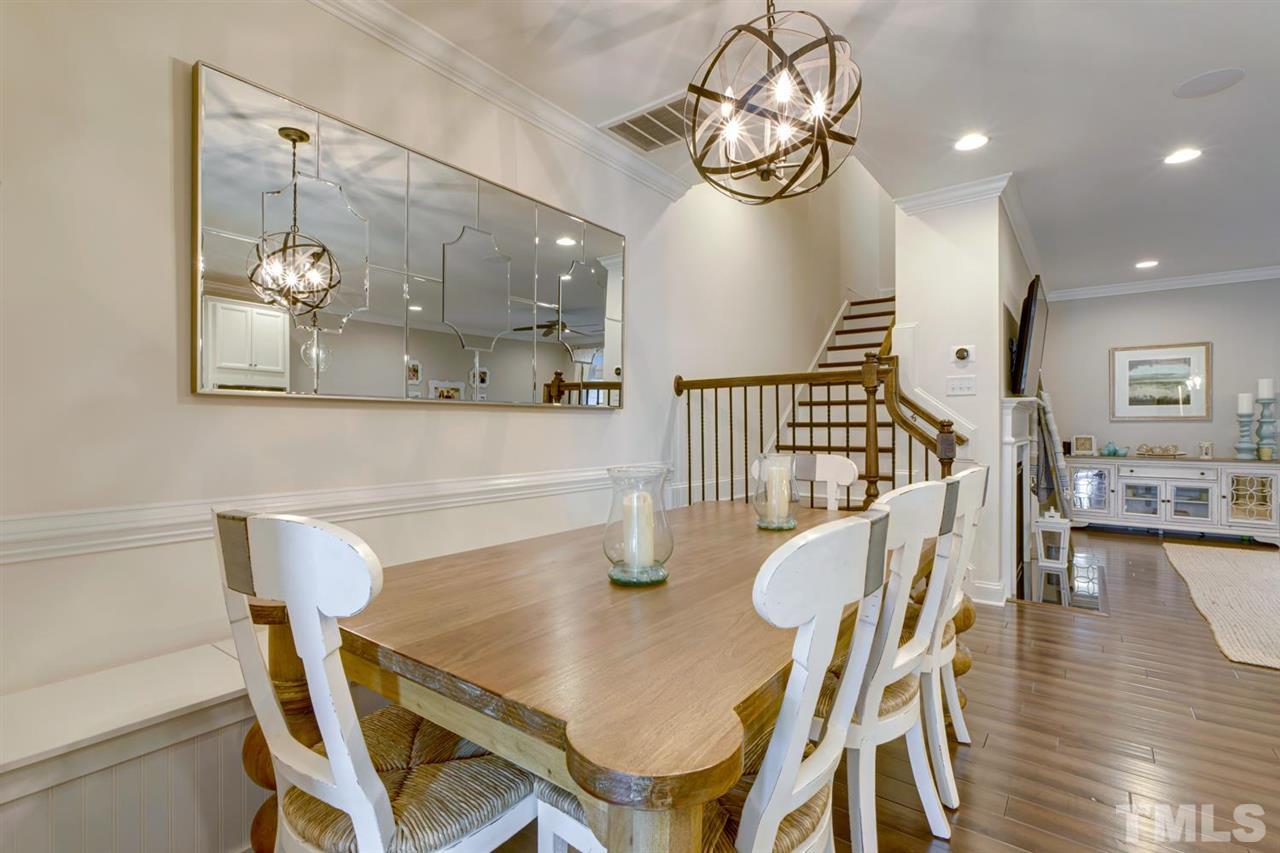 708 Fallon Grove Way Raleigh, NC 27608 - Photo 12 of 30 a dining room with furniture and wooden floor