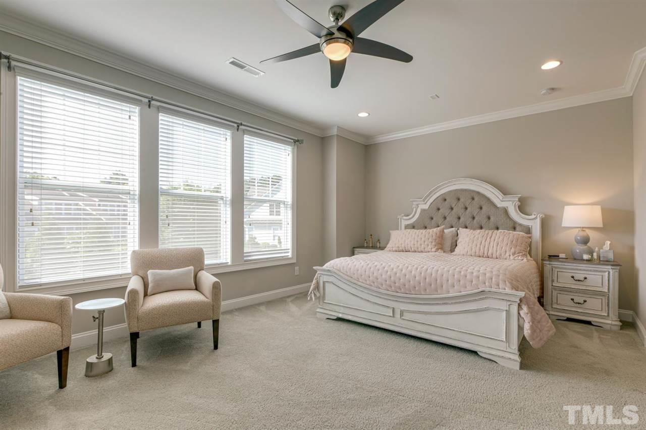 708 Fallon Grove Way Raleigh, NC 27608 - Photo 18 of 30 a bedroom with a bed and a couch