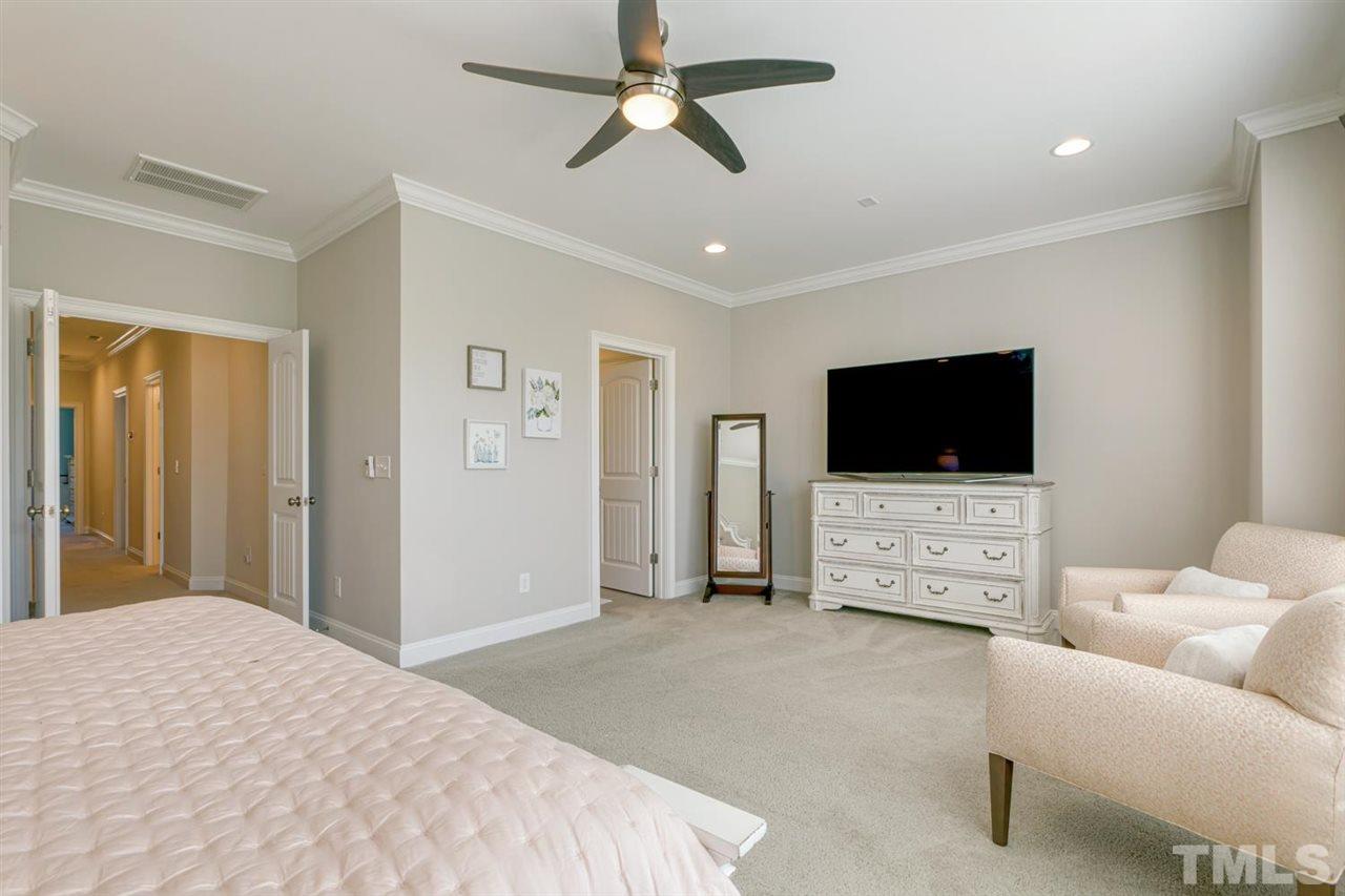 708 Fallon Grove Way Raleigh, NC 27608 - Photo 19 of 30 a living room with furniture and a flat screen tv