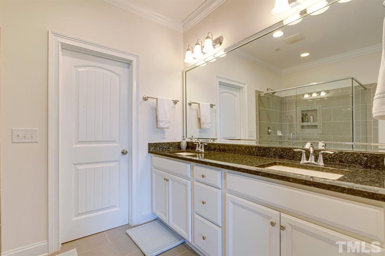 708 Fallon Grove Way Raleigh, NC 27608 - Photo 21 of 30 a bathroom with double sink and a mirror