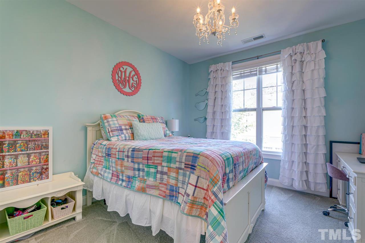 708 Fallon Grove Way Raleigh, NC 27608 - Photo 24 of 30 a bedroom with a bed and a window