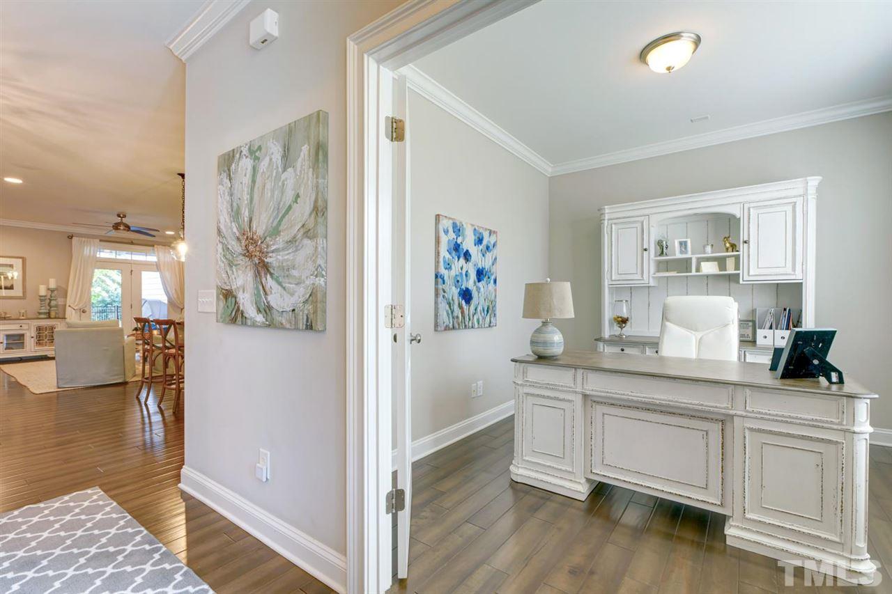 708 Fallon Grove Way Raleigh, NC 27608 - Photo 4 of 30 a kitchen with white cabinets and sink