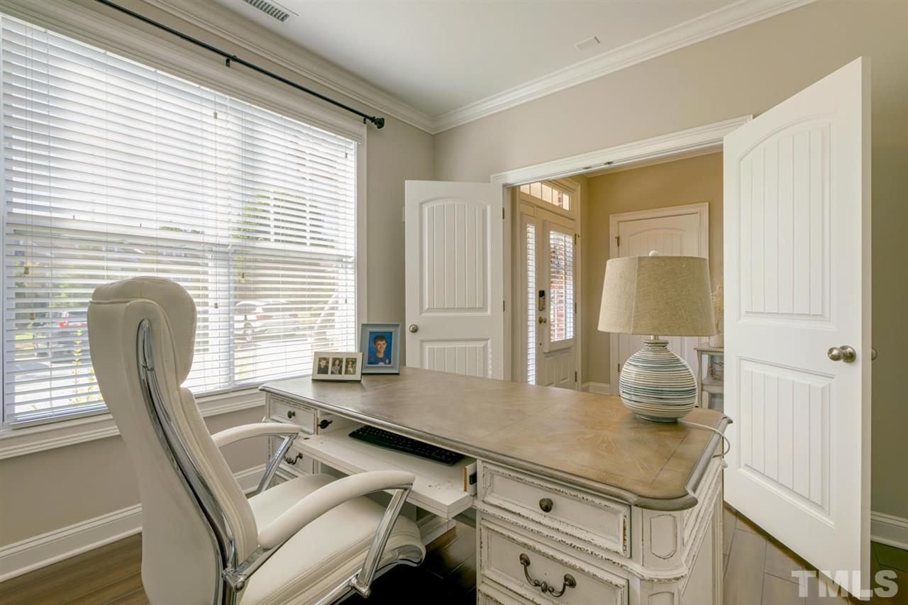 708 Fallon Grove Way Raleigh, NC 27608 - Photo 5 of 30 a room with furniture and a window