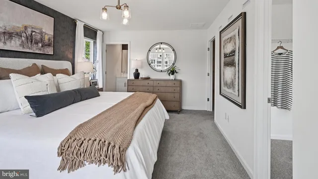 a bedroom with bed and window