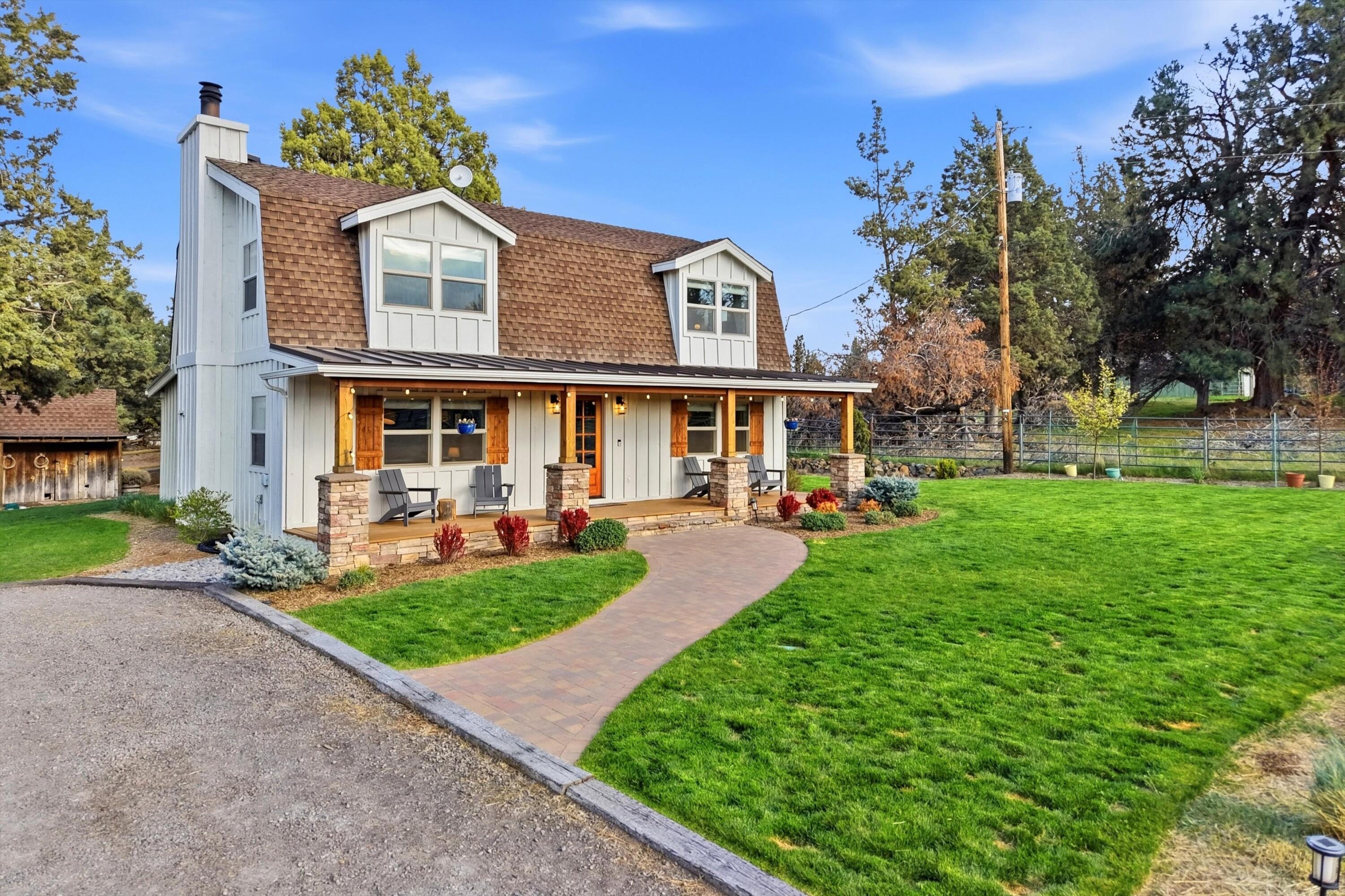 61280 Larsen Road Bend, OR 97702 - Photo 2 of 58 front view of a house with a yard