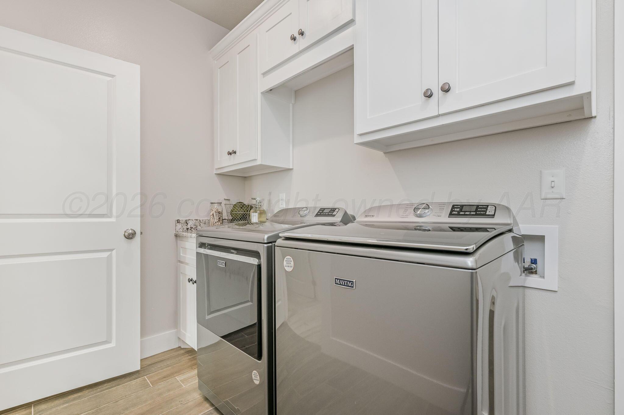 26150 Newton Road Canyon, TX 79015 - Photo 14 of 43 a utility room with sink dryer and washer