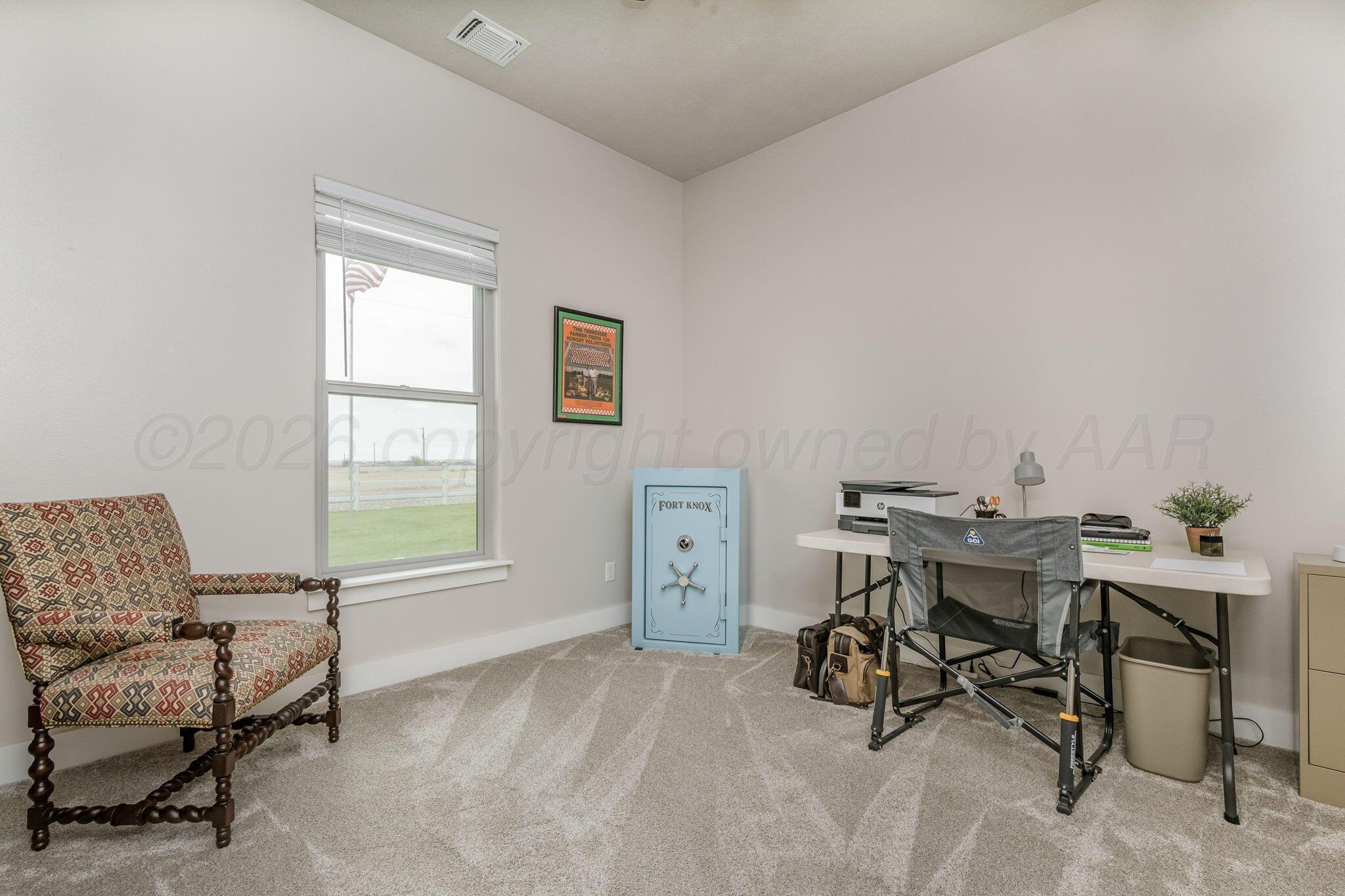 26150 Newton Road Canyon, TX 79015 - Photo 20 of 43 a view of a workspace with furniture and a window