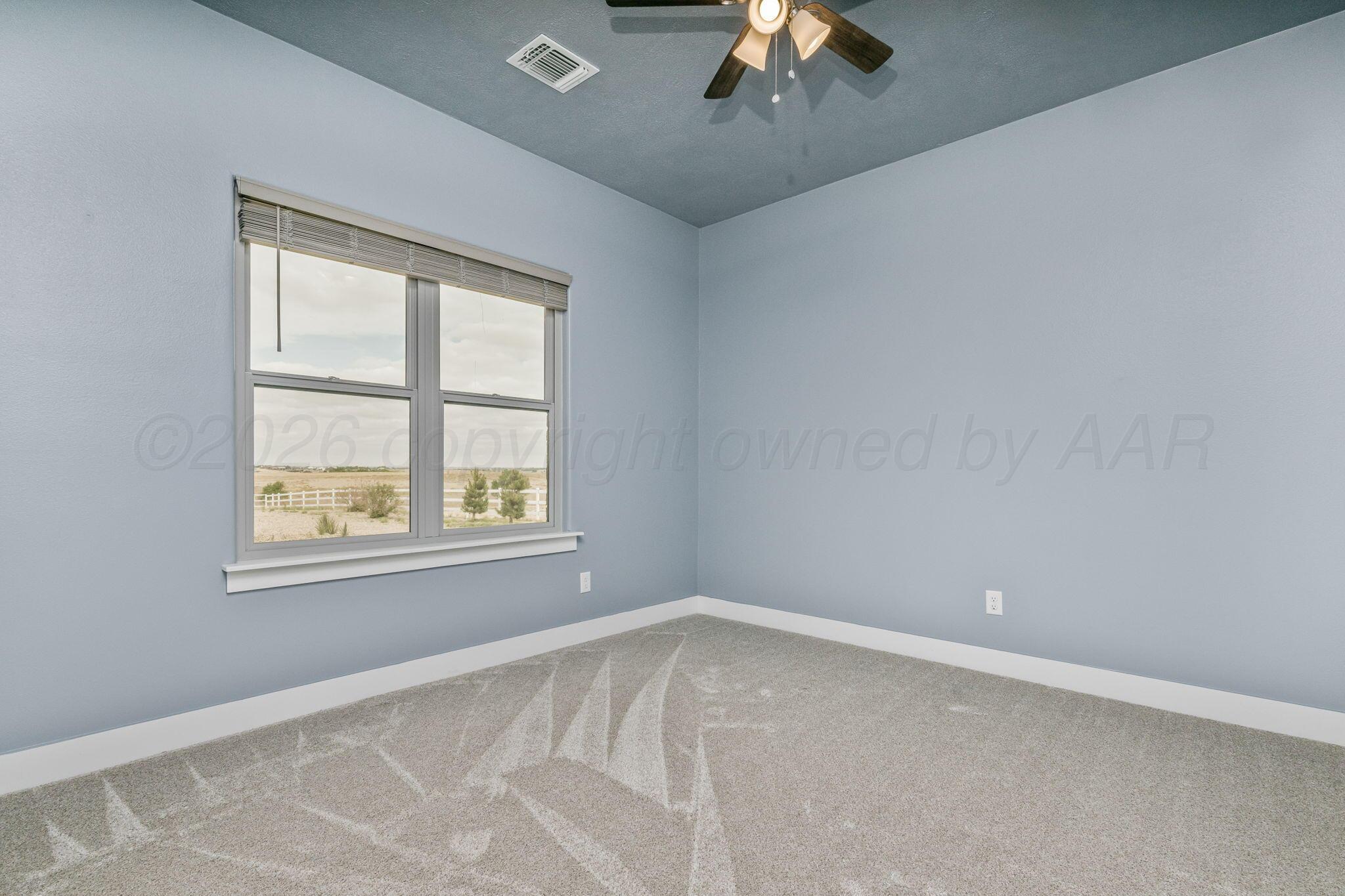 26150 Newton Road Canyon, TX 79015 - Photo 23 of 43 an empty room with a window