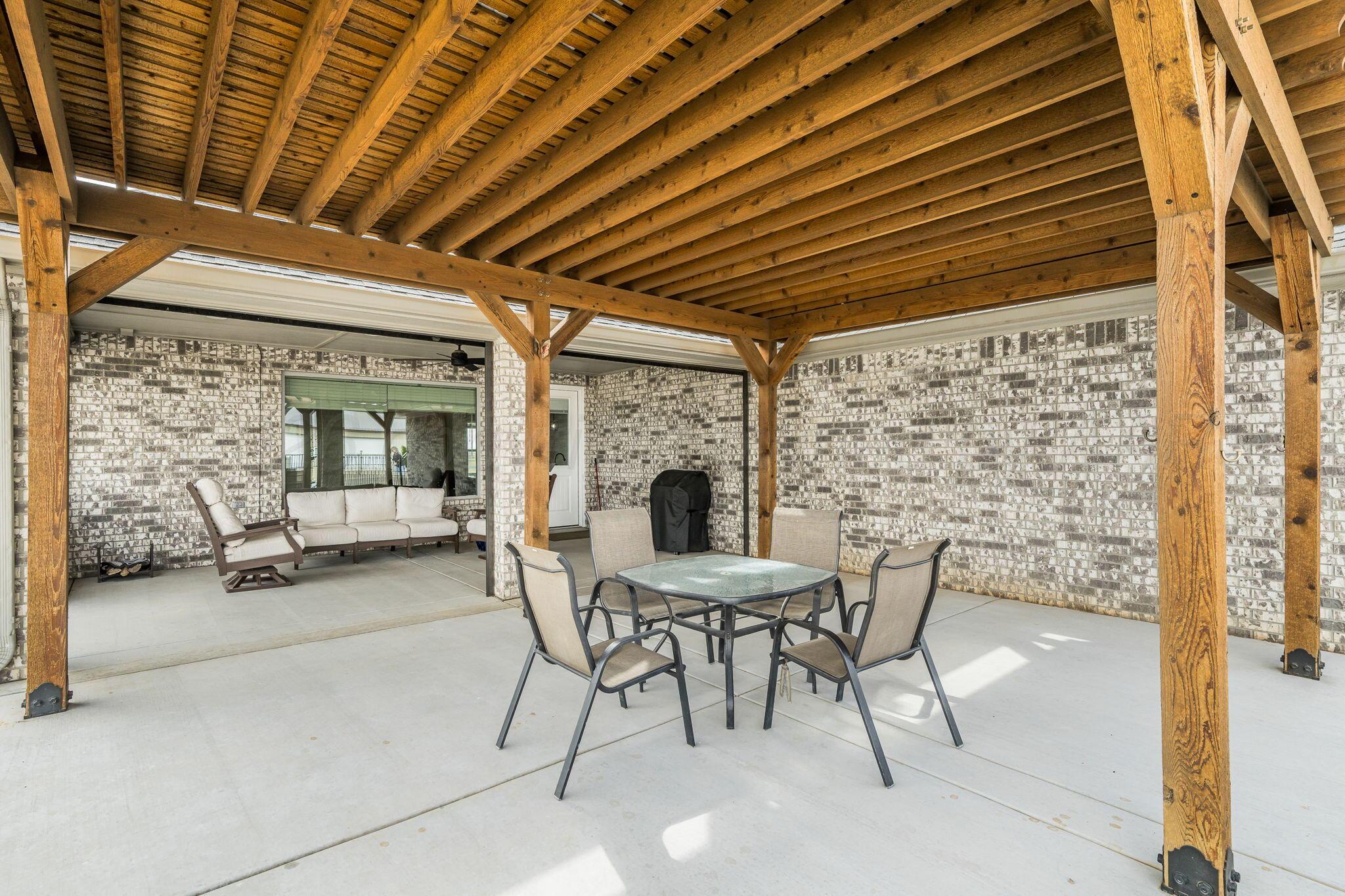 26150 Newton Road Canyon, TX 79015 - Photo 27 of 43 a view of a porch with furniture and a fireplace