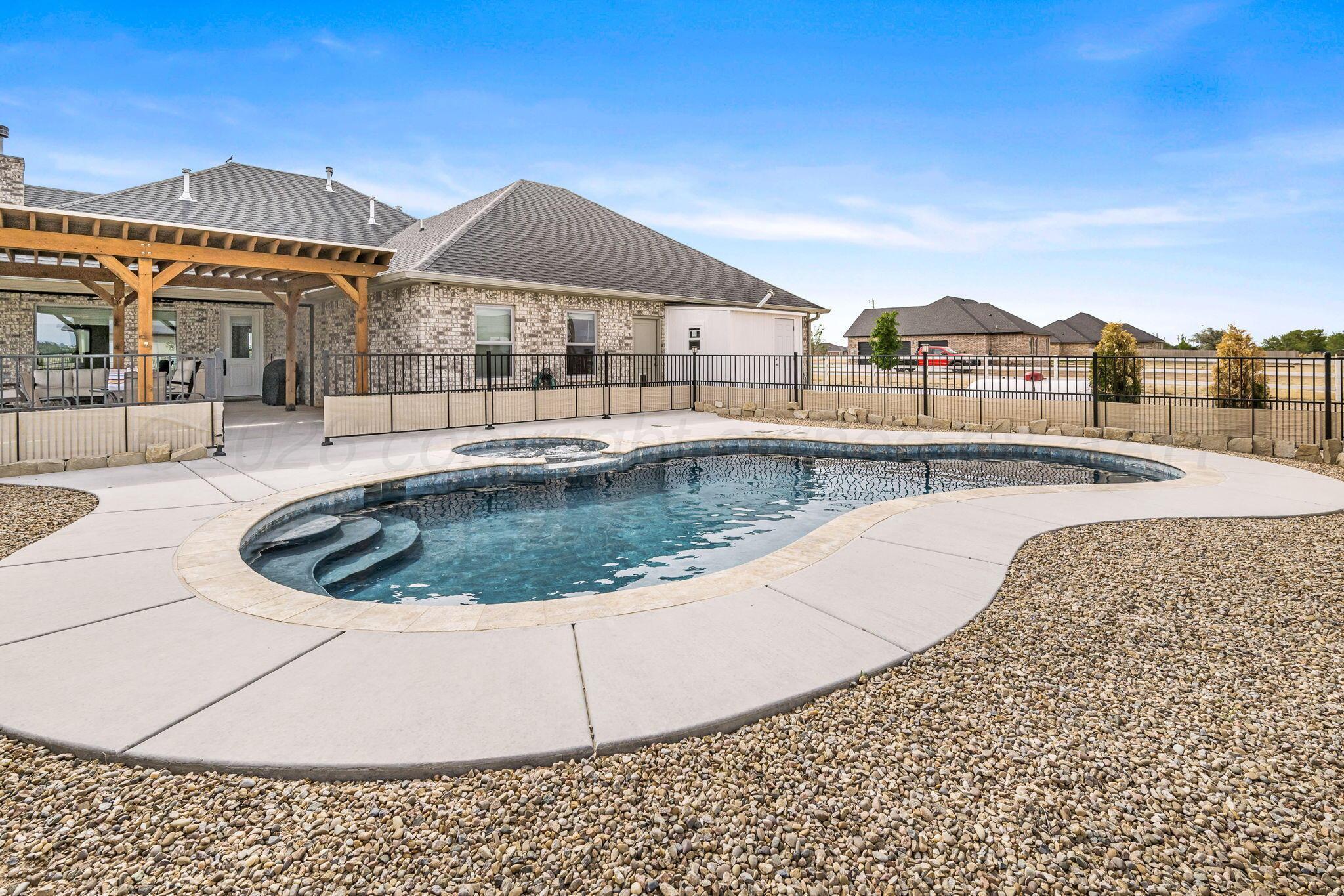 26150 Newton Road Canyon, TX 79015 - Photo 28 of 43 a view of a house with pool and sitting area
