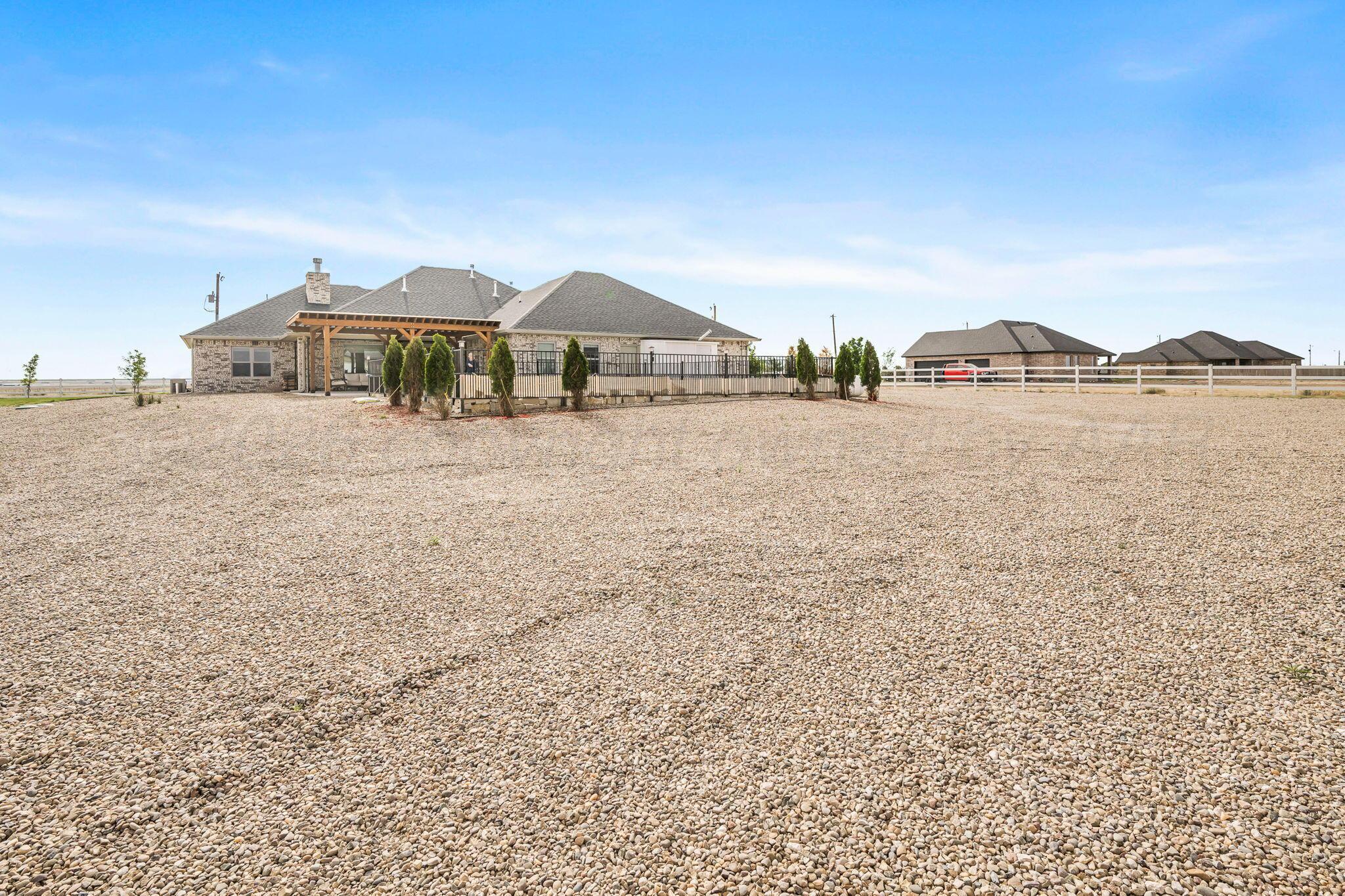 26150 Newton Road Canyon, TX 79015 - Photo 31 of 43 a front view of a house with a yard