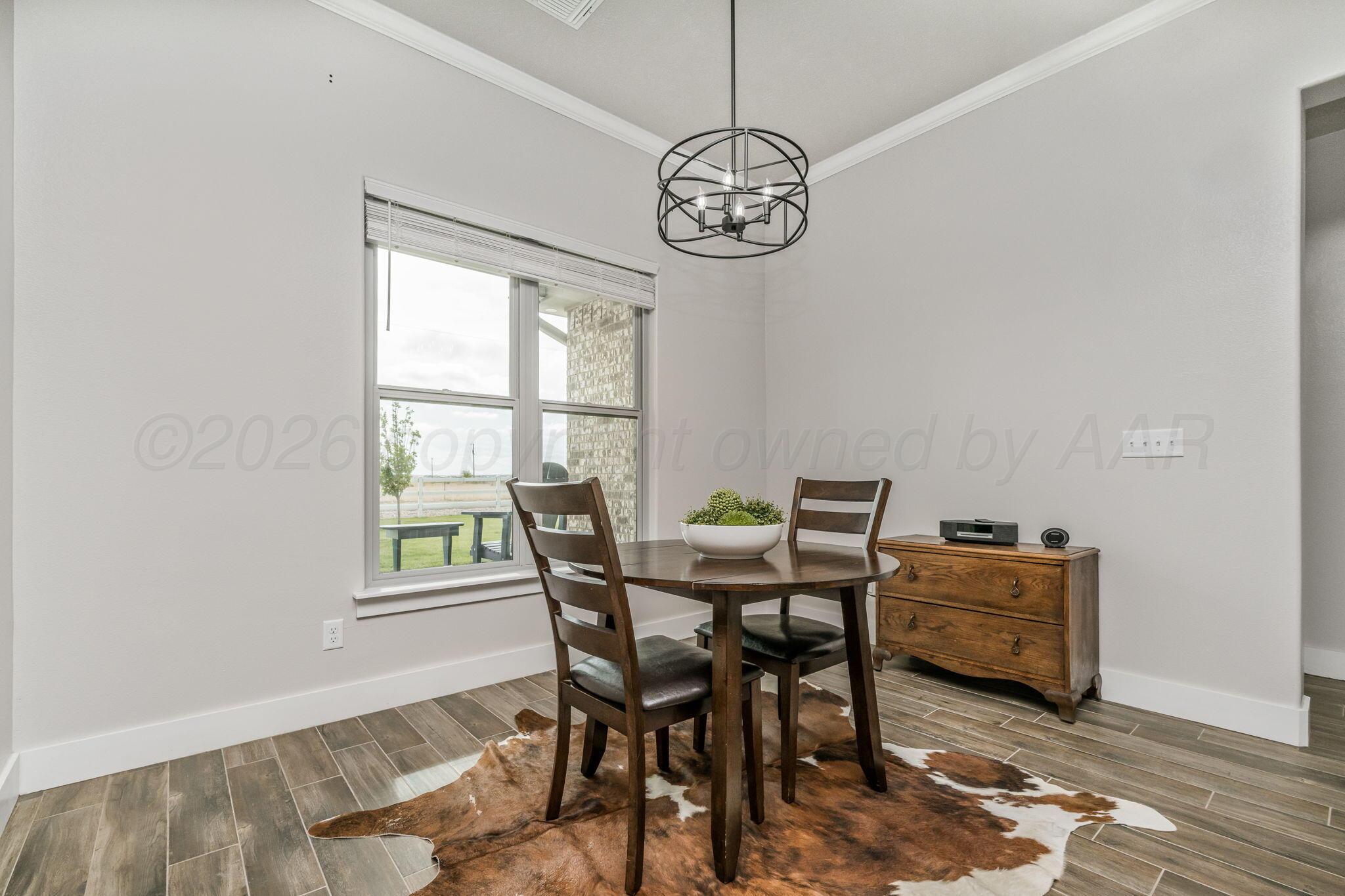 26150 Newton Road Canyon, TX 79015 - Photo 5 of 43 a view of a dining room with furniture window and outside view