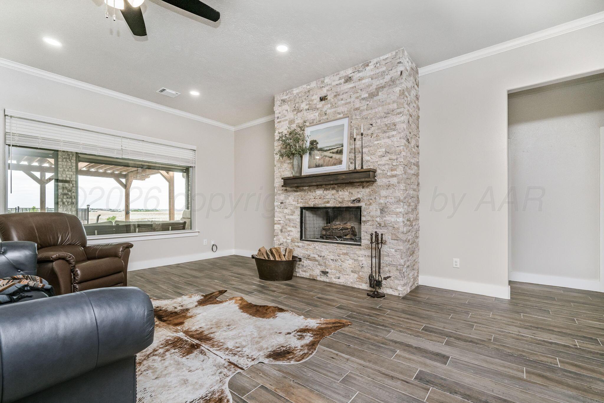 26150 Newton Road Canyon, TX 79015 - Photo 9 of 43 a living room with furniture and a fireplace