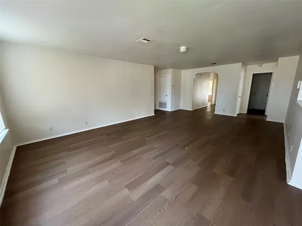 a view of a big room with wooden floor