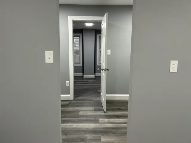 a view of staircase with white walls