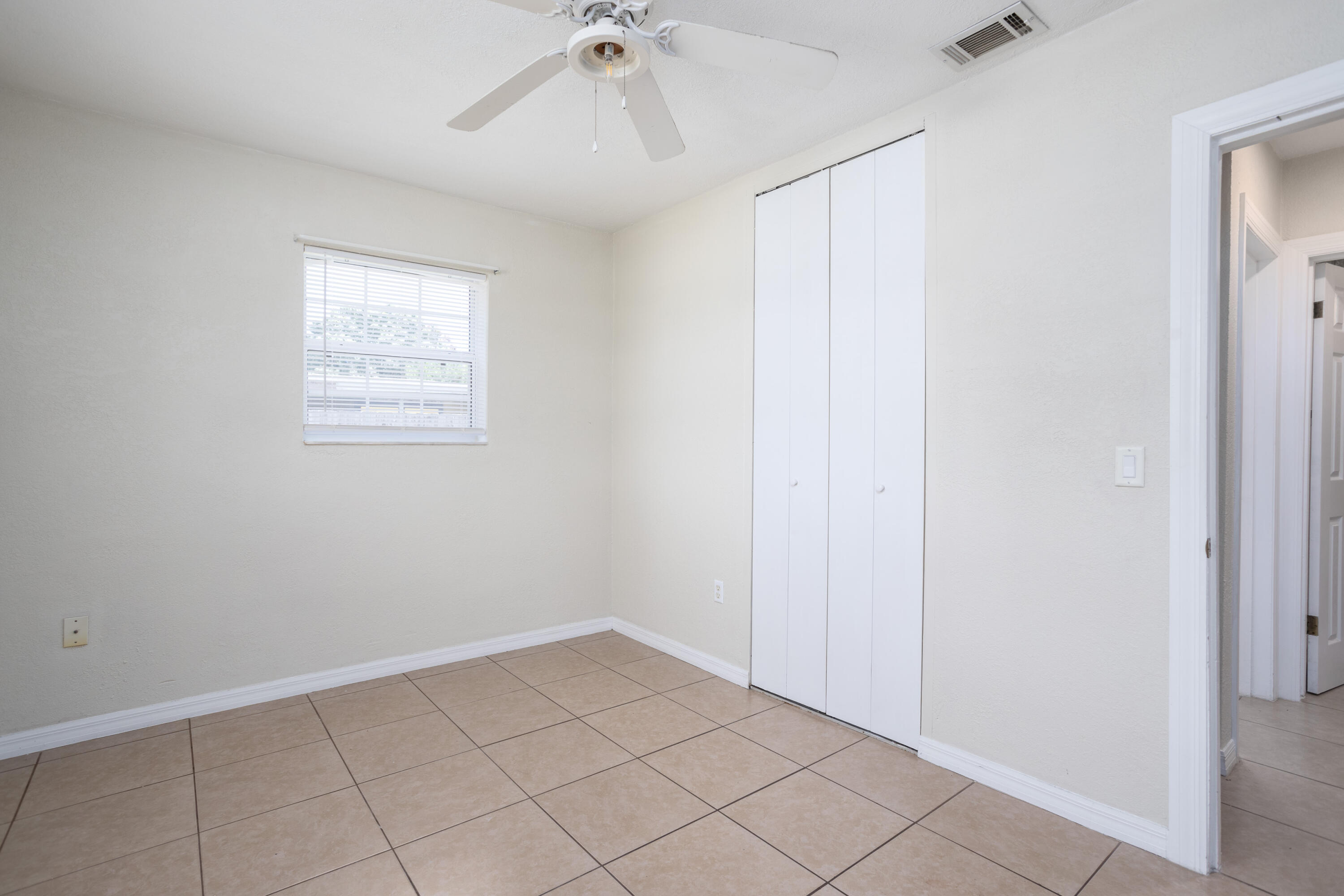 319 West Rutgers Street Melbourne, FL 32901 - Photo 11 of 19 a view of an empty room and a window